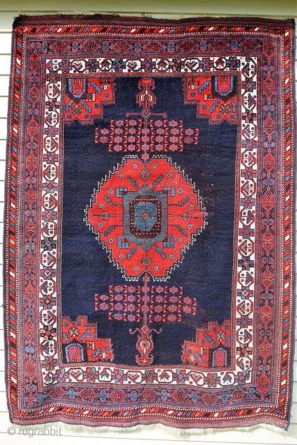 Afshar - about 4'10" x 6'9". Beautiful color and nicely executed 'beatle' medallion and corner spandrels, but not without some scattered central wear.  

        