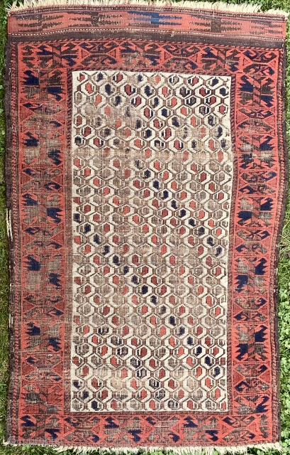 Baluch - about 32” by 49”  with wear and oxidation on an ivory field.  Kilim band removed from one end.           