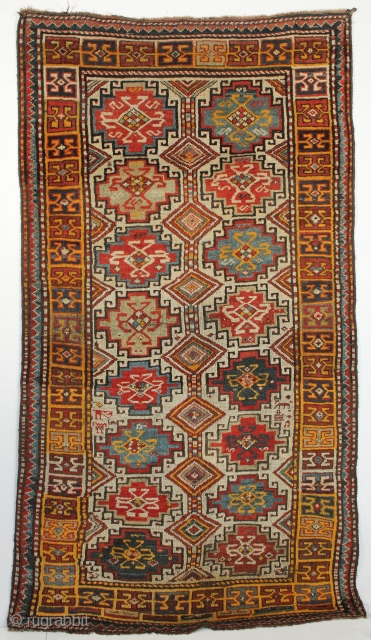 a superb Caucasian Kazak, Moghan region, with memlimgul design. Circa the late 19th century. 3-10 x 7-2 ft.               