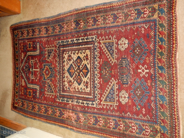 KAZAK OR KUBA RUG WITH BLUE SIDES , THIN RED WEFTS , AND BRAIDED ENDS ...DATED 1898
A BIT OF WEAR- 40 X 60 INCHES         