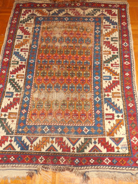 caucasian village rug, mabye a shirvan, with a gold field that I was going to repair and retail, but here it  is for sale for $480 or BO
size is about 3  ...