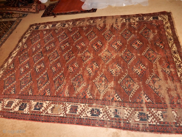 OLD YOMUT YOMUD MAIN CARPET - GREAT SIZE OF 6 X 8 FT - LOTS OF AGE AND LOTS OF WEAR BUT SOLID FOUNDATION- ARCHAIC DESIGN ELEMENTS IN THE BORDER ....  