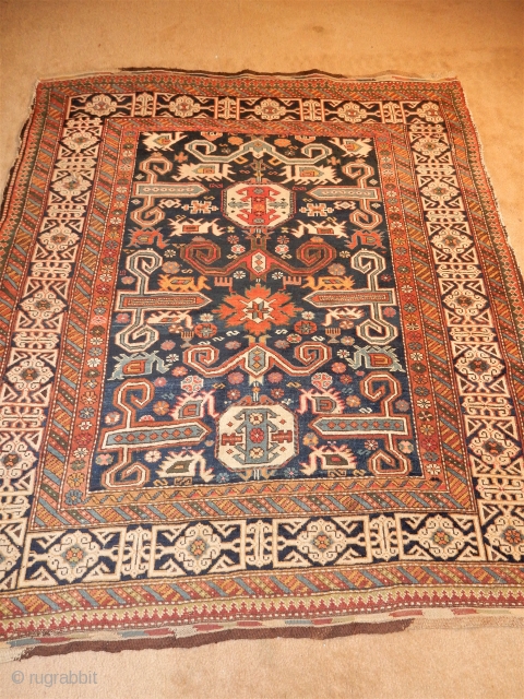 SUPERBLY DESIGNED AND LARGE 55 X 66 INCH KUBA RUG WITH EXCELLENT GLOWING PILE - COMPLETE ORIGINAL  BRAIDED ENDS - WONDERFUL ANIMALS WOVEN HERE AND THERE - 
SEWN TEAR ON THE  ...