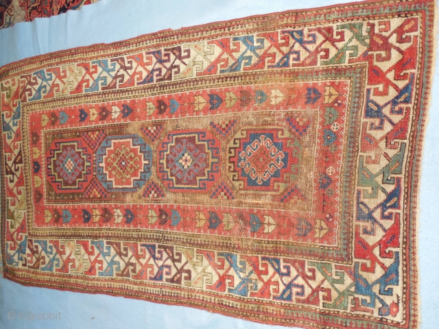 SHIRVAN/SOUTH CAUCASIAN/ MOGHAN  THAT HAS TAPE GLUED TO THE BACK

TO MAKE IT LIE FLAT ON THE FLOOR.

ABOUT 4 X 7 FT.

GOOD OLD NATURAL DYES.

BARGAIN-        