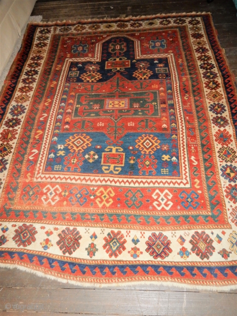 ALMOST A ROOM SIZE ANTIQUE FACHRALO KAZAK PRAYER RUG- WITH A SIZE OF 66 X 90 INCHES- 
5 1/2 X 7 1/2 FT- NEEDS A  GOOD WASH - A FEW FAVORITE  ...