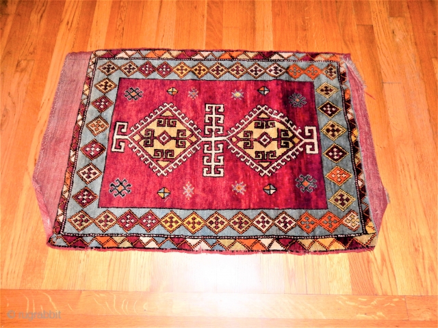 LARGE SIZED YASTIK IN REALLY SUPER NEAR FULL PILE CONDITION WITH FULL KILIM ENDS 
ABRASH NOT NEARLY AS DARK AS PHOTO SHOWS
2 X 3 FT
 
$350       