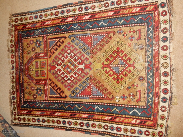 SHIRVAN PRAYER RUG THAT NEEDS A GOOD WASH 
VERY COLORFUL WITH LARGE ANIMALS NEAR THE LOWER BORDER
$550                