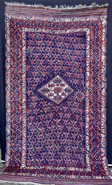 Superb Afshar carpet 2.56m x 1.47m in excellent overall pile condition and retaining its long, plain-weave skirts each end.              