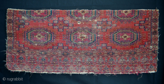 A rather battered fragment of an early 19th century Tekke '6-Salor gul' chuval 1.28m x 0.53m (4' 2" x 1' 9").            