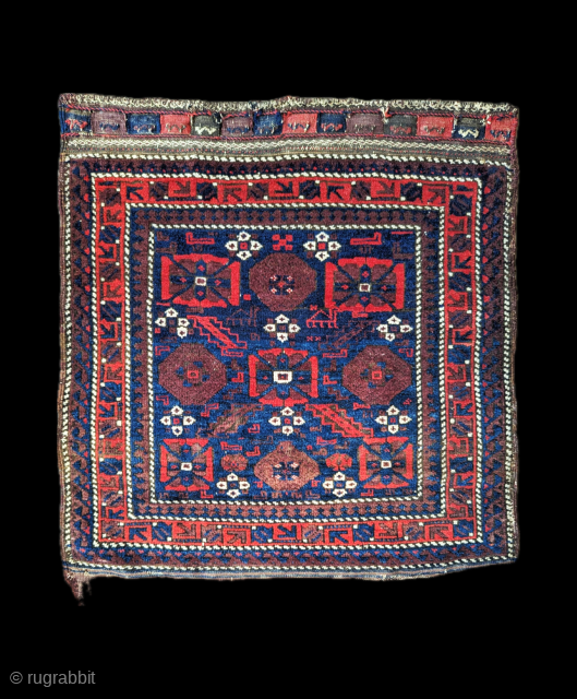 Glowing reds and blues in soft, glossy woollen-pile with stylised camels depicted in the centre of this 19th century bagface made by Timuri tribes. 76cm sq. (2'6" sq.)
Listed on my website www.brianmacdonaldantiquerugs.co.uk  ...