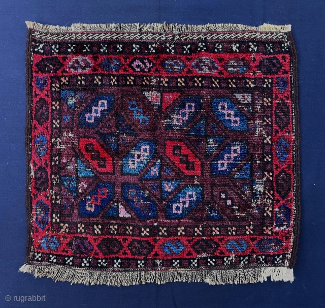 Early Baluch bagface with beautiful use of aubergine and light-blue.                       