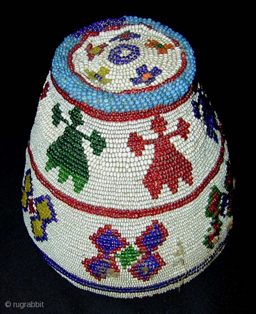 Beaded Hat. Kohistan. Mid-20th century or earlier. Great colours. Height 14, diameter 16 cms.                   