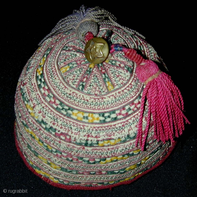 Turkmen Child's Embroidered Hat. Silk tassles and Soviet brass button. 1st half 20th c. Diameter 12, height 8 cms.              