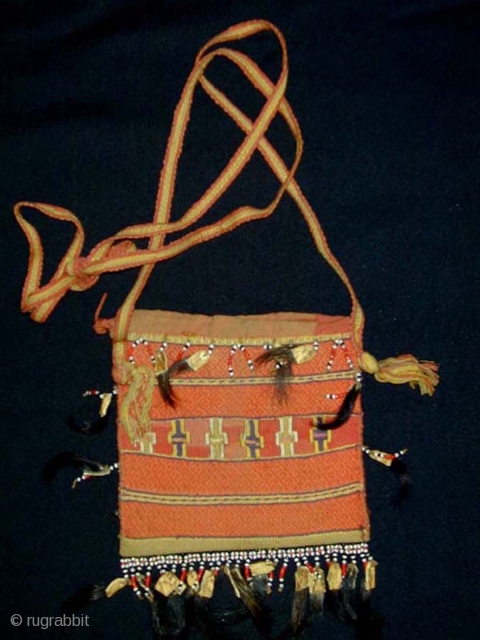 Timorese Betel-nut Bag (Aluk). Antoni people. Cotton flatweave and supplementary weft wrapping (Buna) with glass beads, bamboo, and horsehair. 16x15 cms. excl. strap. First half 20th c.      