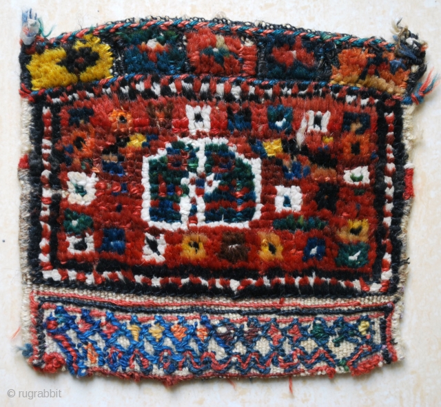 Antique tiny little Luri bag-face. Prob. late 19th c. 20 x 20 cm. The white pile is of cotton. The closing end squares are pile knotted. Nice colours. Good condition.   