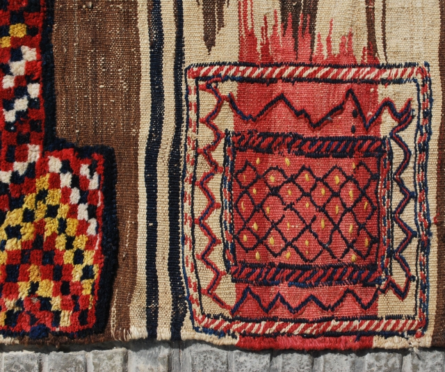 A very tribal Bakhtiari khorjin (double bag), prob. early 20th c. 90 x 240 cm. Unsewn sides. In good condition. Slight stains to one back. Very attractive pile parts and "fireplace" back  ...