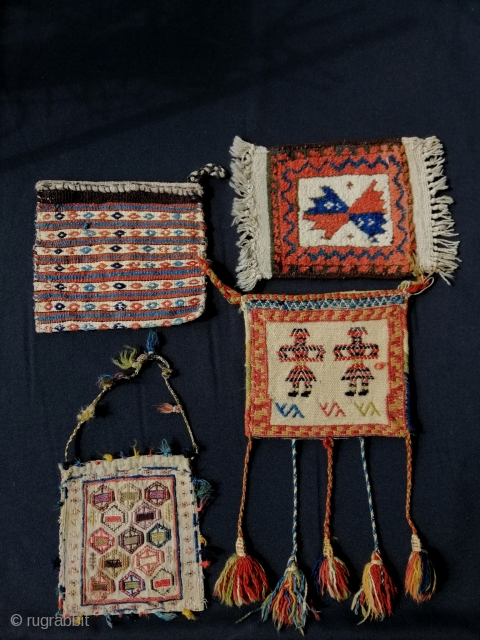 Three tribal vanity bags (Kurdish, Qashqāï and Shāhsavan) and one Baluch mini rug.                    