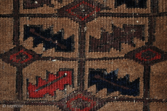 Antique Baluch, 19th c. 70 x 129 cm. Very good colors. Uneven wear. Deeply corroded black and a relatively high (embossed like and thick) camel and plum that make one wonder about  ...