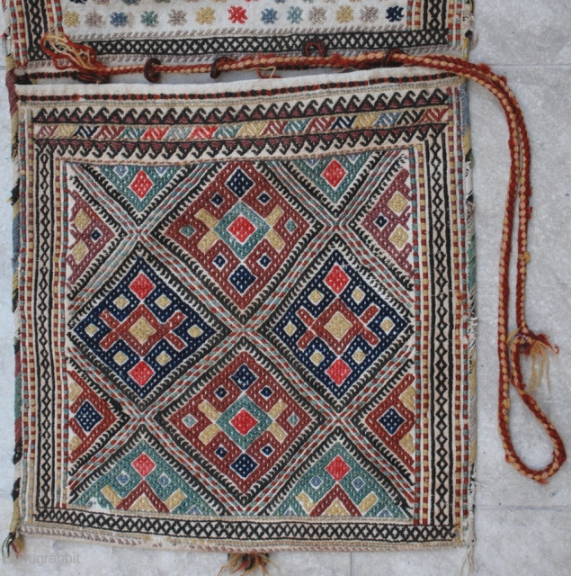 NW Persian complete saddlebag, early 20th c. 42 x 111 cm. Wool extra weft brocade on cotton. Nice natural colours, but some fuchsine and a few bright red highlights. Fine weave, Excellent  ...