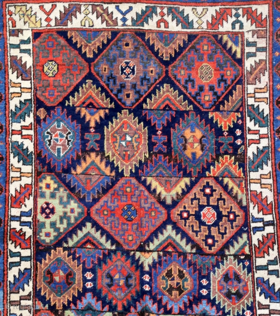 Antique Kurdish rug, 19th c. 128 x 242 cm. Upper end stripe rewoven. Spots of low pile. Corrosion to black. Great natural colors. Great look.        