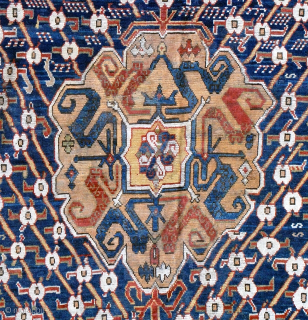 200 x 310 cm. This antique small carpet bear at once primitive and archaic devices that links it to ancient Anatolian rugs on one hand and a medallion that could well be  ...