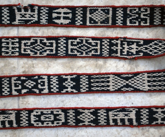 Bakhtiari pack band with carved wodden lock and a rich variety of archaic and characteristic motifs. 5 x 830 cm. (2" x 27'8"). Well preserved in general with very few slightly damaged  ...