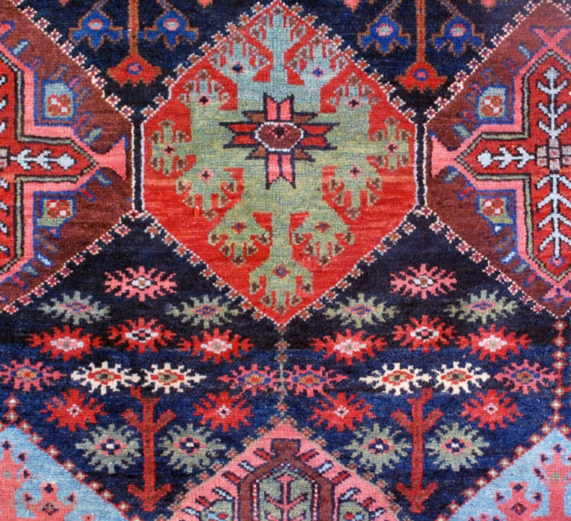 Bakhtiari rug from the village of Harchegan. 140 x 216 cm. Circa 1920-30. All natural colours. Wool weft. Spot of lpw pile. Original upper end, secured lower end.     