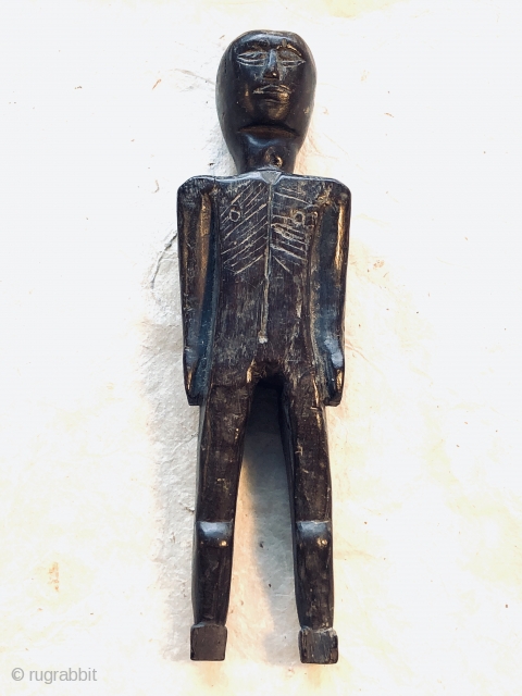 Old doll or amulet, hand-carved from fine-grained hardwood, polished to a smooth gloss from wear and use.  Collected about 1990 in Nepal by Himalayan Antiques, inventory number 30520.

h 9" x w  ...