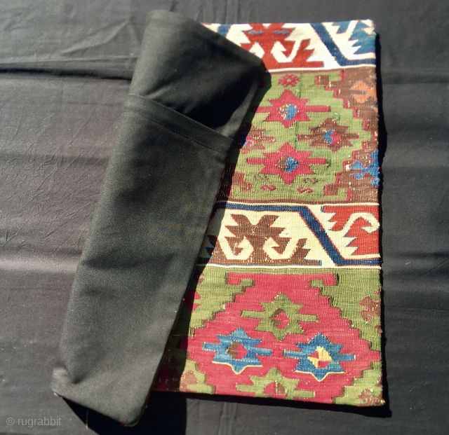 Simply a beautiful cushion......or Yastik in Turkish!
Anatolian kilim fragment mounted on black canvas with zipper.
Antique, natural saturated colors, lovely pattern with stars.
Size is cm 58x61. 
Approx date is end of the 19th  ...