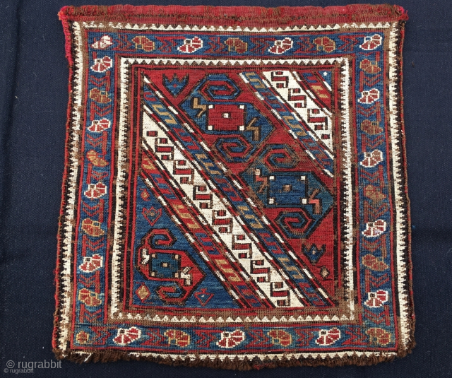 Azerbaijan. 3 Dragons in a whirl of snow and carnations. Khyzy village, north of Baku. Sumack khorjin bag face. Cm 41x43. Second half 19th century. Deep natural saturated colors. A rare, great  ...