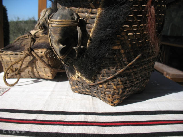 Two Naga head basket bought during last Naga festival held in north-western Myanmar mid January 2012.
Naga head basket are usually decorated with monkey or dog skulls and dyed goat hair.


These types of  ...