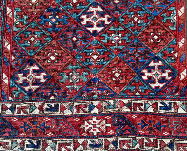 Shahsavan/Khamseh sumack saddle bag face. 
Cm 48x65. End 19th c. Great saturated colors. 
Very interesting diamond lattice main field with a repeating cruciform motif. Interesting borders with stylized arrow motifs, etc.... 
See  ...