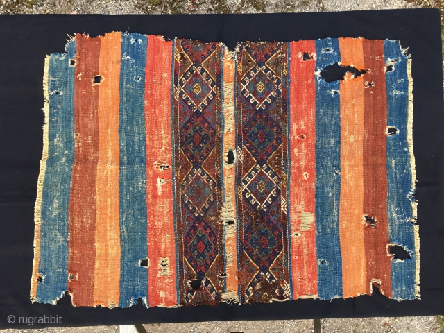 An Anatolian wreck! But, what a wreck! Great natural saturated colors, lovely sumack center part. Holes everywhere, and still this antique peasant tribal art cuval sings the glory of those days, of  ...