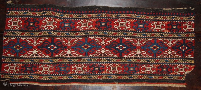 Beautiful Caucasian, Karabagh? sumack mafrash side panel. Cm 40x98 ca. Datable to the 3rd or 4th quarter of the 19th century. Main pattern with complete cruciform motif alternated with opposite halve ones.  ...