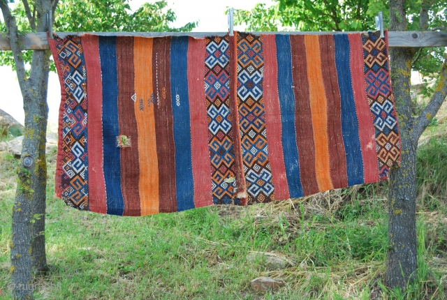 Eastern Turkey, probably Adiyaman, open cuval. A few holes & tears, but on the whole in good condition. Great colors! Good age. Size is cm 95x190.
       