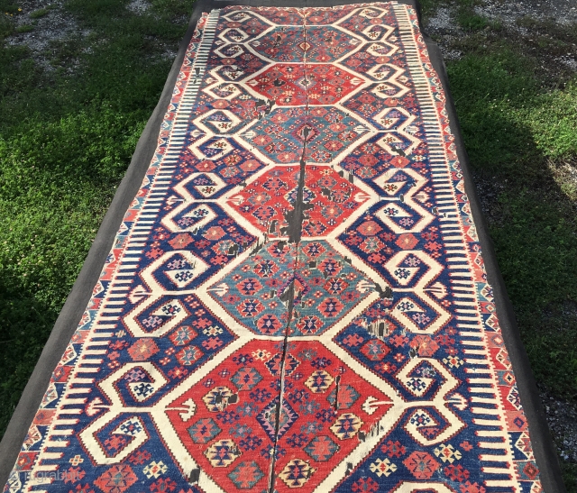 Aydin Cine kilim. Size is cm 150x360 ca. Second half 19th century. Professionally mounted on black linen. Gorgeous colors. Fantastic deep madder red, great cochineal pink, indigo blue, light yellow,, etc. Very  ...