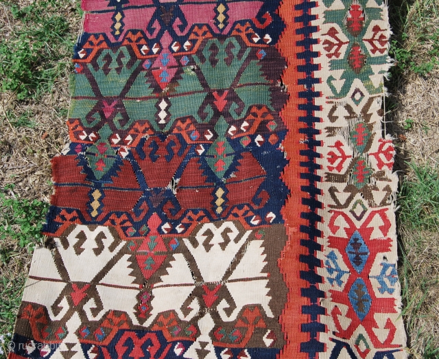 Antique Malatya kilim strip. Size is cm 75x395 or 2'8"x11'2" ca. Age is first quarter 19th century. Colors are simply wonderful: indigo, green, madder, cochineal, aubergine, etc....all fantastic. Some brown must have  ...