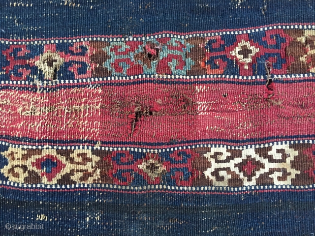 Reshwani/Sinanli kilim fragment. Cm 70x90. Datable 1840/1860. Amazing textile with lots of cochineal, indigo and metal thread. Worn, torn, battered, but still glowing with lots of character, aura, power. Great colors.
  