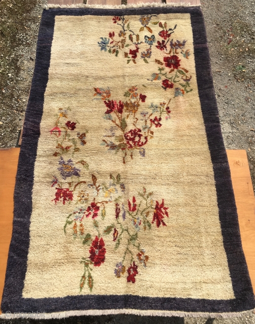 Flower vintage yatak or sleeping rug. Cm 140x240 ca. Datable 1920/1940. Central Anatolia, could be Karapinar. Very high pile. Beige field with blueish border. Condition issues: a couple of small moth holes  ...