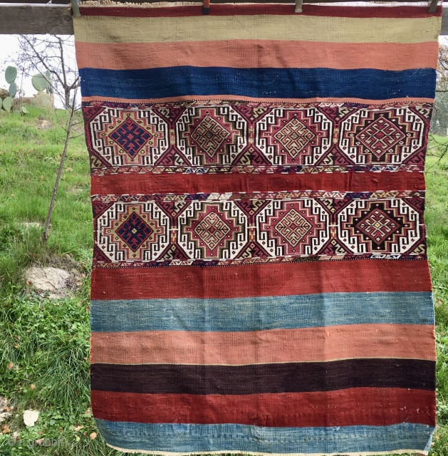 Malatya area, Sinanli tribe open cuval/storage bag. Cm 118x156. Late 19th, early 20th c. Flat weave plus sumack in the central part. Some metal thread. Natural colors. Two, three small holes, but  ...