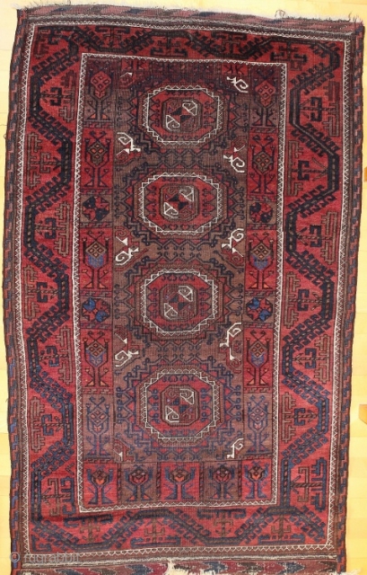 Baluch rug; size 117 x 188 cm (3`10" x 6`1"); 
In a vertical row four big, precisely drawn Salor Güls are allocated on a brown main filed. As secondary Gül one find  ...