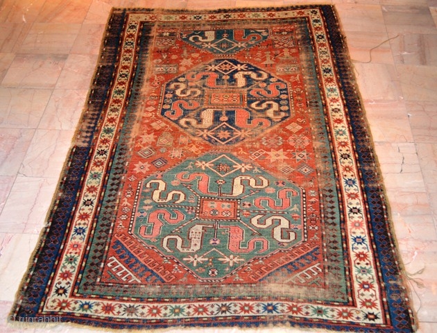 Old Caucasian Kazak Worn + Damage . Circa 1800s.1900  Size is 4.4 x 7 (134 x 213 cm)

Price $250.00 + Shipping           