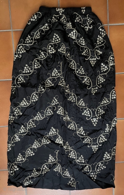 Black silk satin skirt embroidered in a grape vine pattern (symbolizing fertility) worked in silver metal thread and silver sequins. The background cloth is quite heavy, to take the weight of the  ...