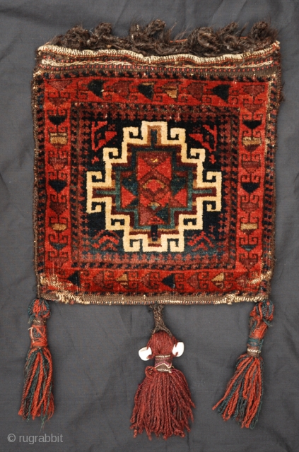 Very good Baluch pile chanteh. Great dyes, original tassels with sea shells. 
Very nice flatwoven back. Good condition. 
              