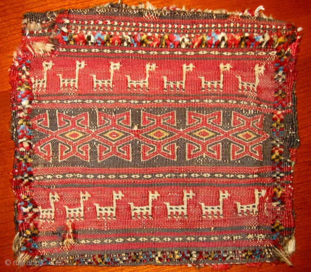 Small southern persian bag, 19th c., 30x28cm. Flatweave with knotted surroundings and striped kilim backside.Condition is well to see on the pics.           