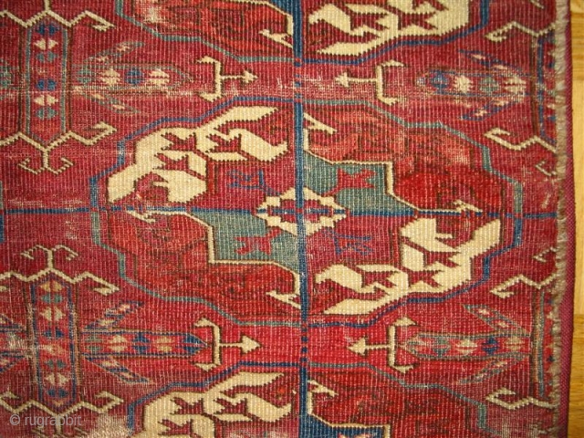 Fragment of an early Tekke maincarpet, appr.1800. Mounted on linen, 47x70cm.
                      