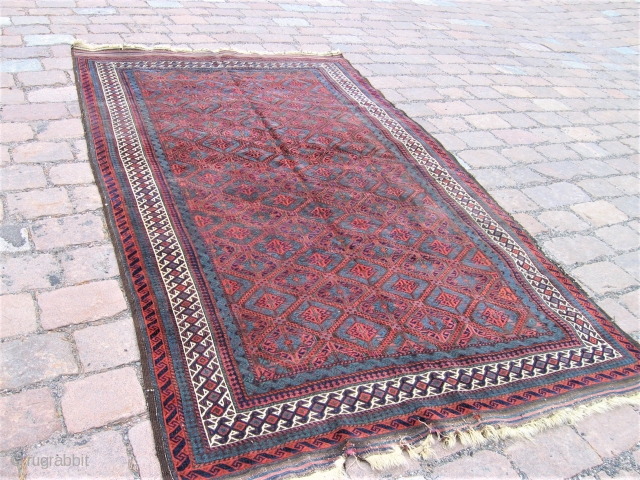 Antique Baluch carpet---Very nice motiv and colours. Reasonable condition. One repaired slitt and kelim ends have repairable  wear. 
.288cmx165cm
1900-1920             