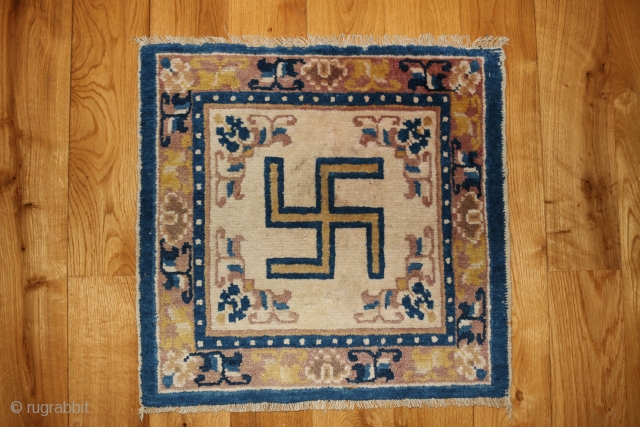 A 19th century ceremonial seating rug. Ningxia, China. 22 x 23 inches.                     