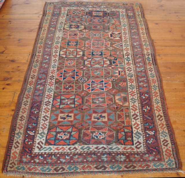 The colours are lovely in this mellow antique Kurdish village rug c1880.
Condition: good with even wear.  
Size: 217x137 cm (7' 1" x 4' 6")
I am closing down so the rug is  ...