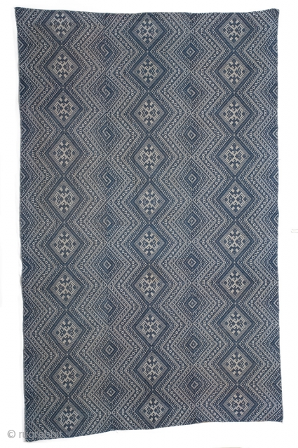 Dong minority textile from Guizhou province, Southwestern China. Indigo cotton supplementary weft weaving on cotton foundation. Woven in 3 panels and joined together. 116cm x 186cm. First half of the 20th century.

The  ...